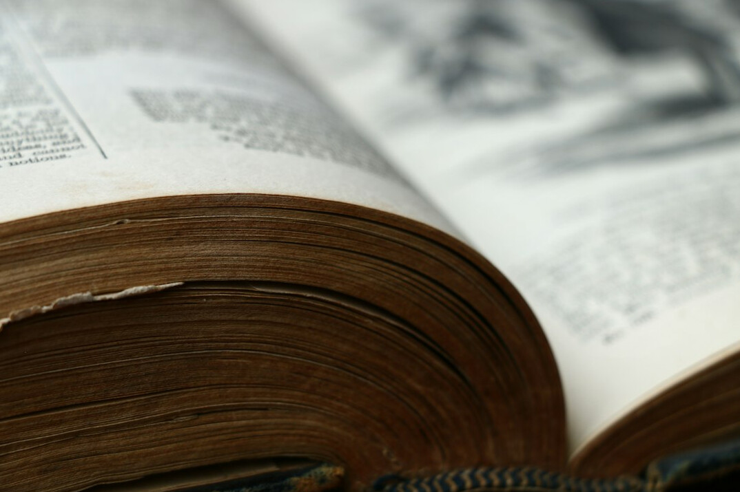 detective reading old book