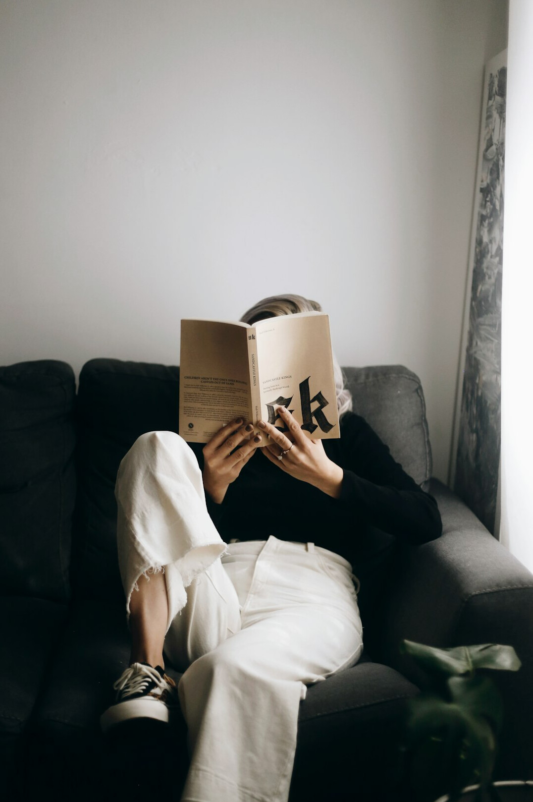 woman reading mystery novel