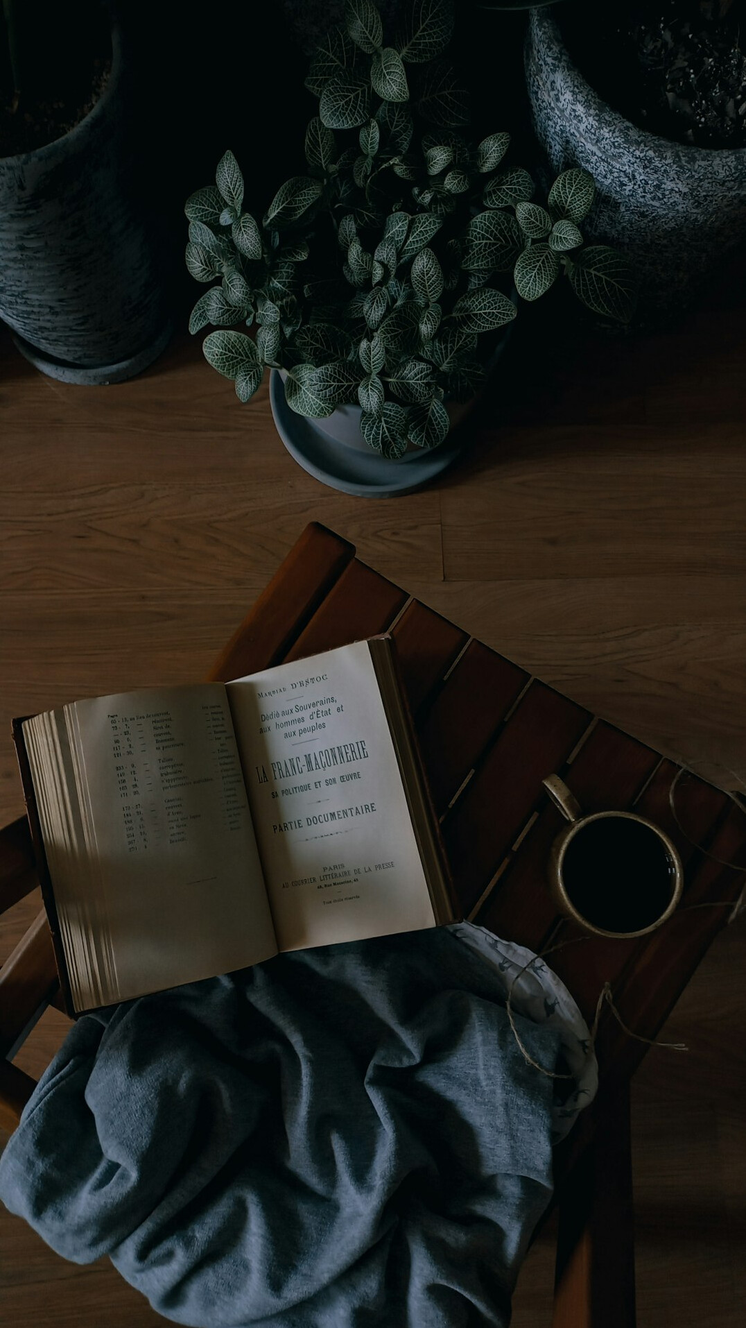 Books and a cup on a table, flat lay
