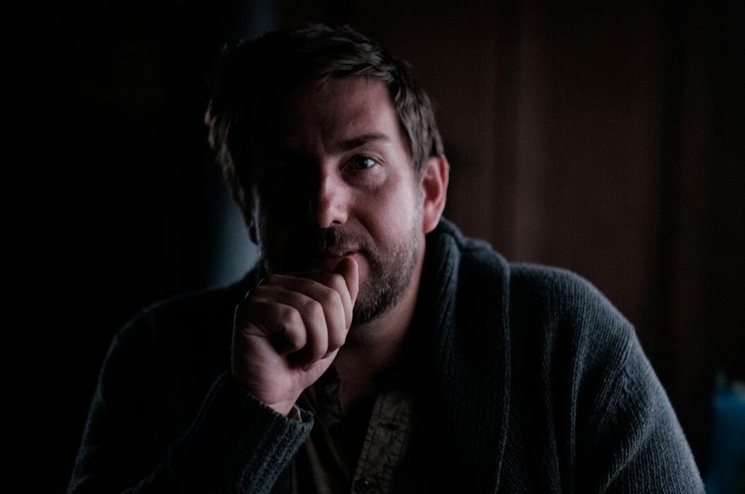 Portrait of a bearded man in a dark sweater